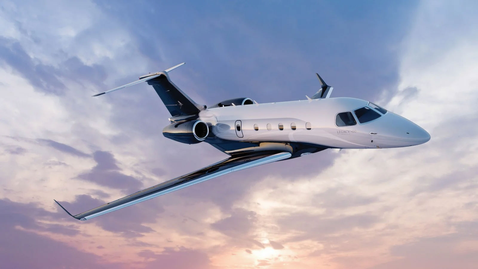 Legacy 450 flying into the sunset