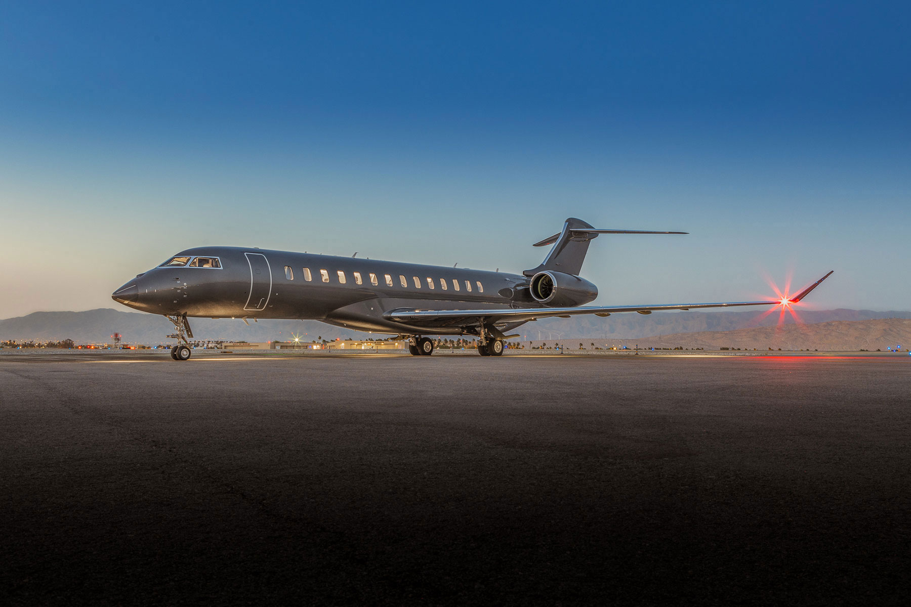Global 7500 taxing on the tarmac at sunset